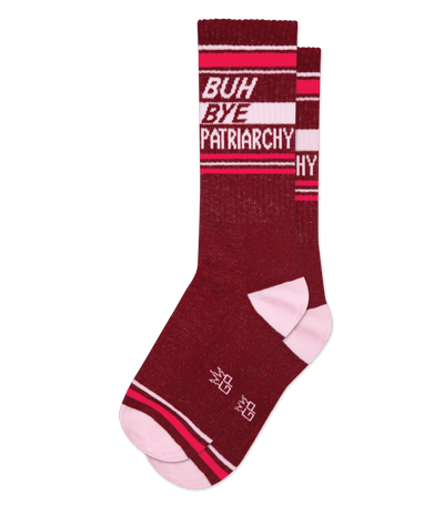 Burgundy socks with "BUH BYE PATRIARCHY" text, white heel and toe, striped pattern.