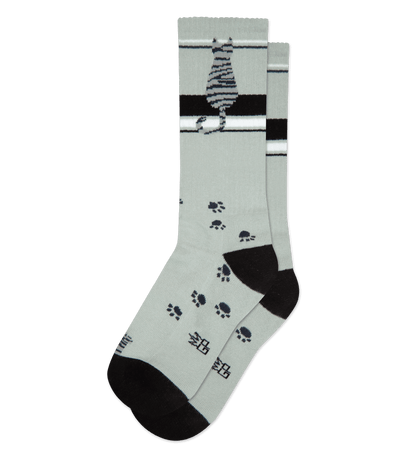 Gray sock with black heel and toe, and lighthouse and paw print pattern.
