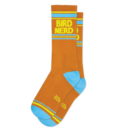 Butterscotch yellow sock with "BIRD NERD" text, light blue accents, on a neutral background.