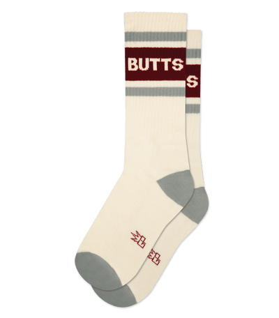 Natural cotton socks with cream accents and the word "BUTTS" in maroon text near the top.