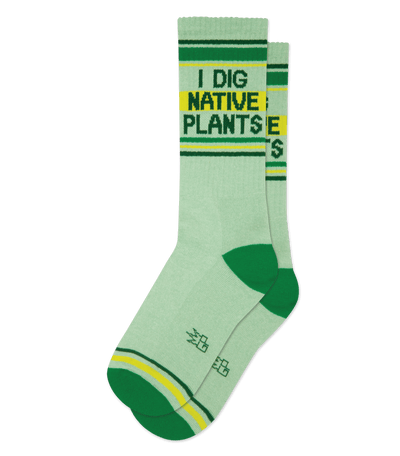 Green socks with "I DIG NATIVE PLANTS" text, featuring dark green accents on toes and stripes.