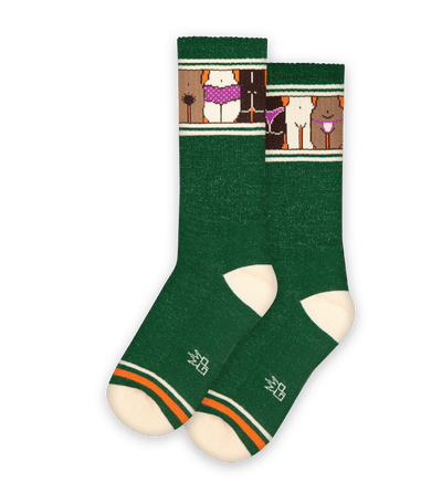 Dark green socks with beachfire yellow accents and animal pattern on the cuff.