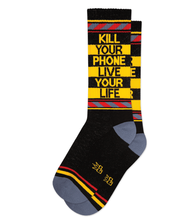 Black sock with gold text: "KILL YOUR PHONE LIVE YOUR LIFE", with red and gold stripes.