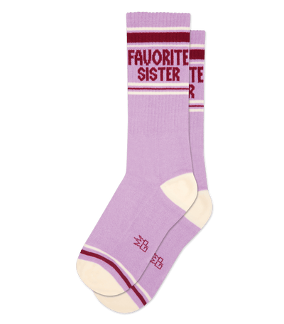 Lilac purple socks with cardinal red accents, featuring the text "FAVORITE SISTER" near the top.