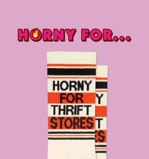 Graphic text "HORNY FOR..." next to various socks with similar text, like "HORNY FOR BOOKS", on a patterned background.