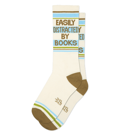 Natural cotton socks with camo green accents, text reads "Easily Distracted by Books" in blue.