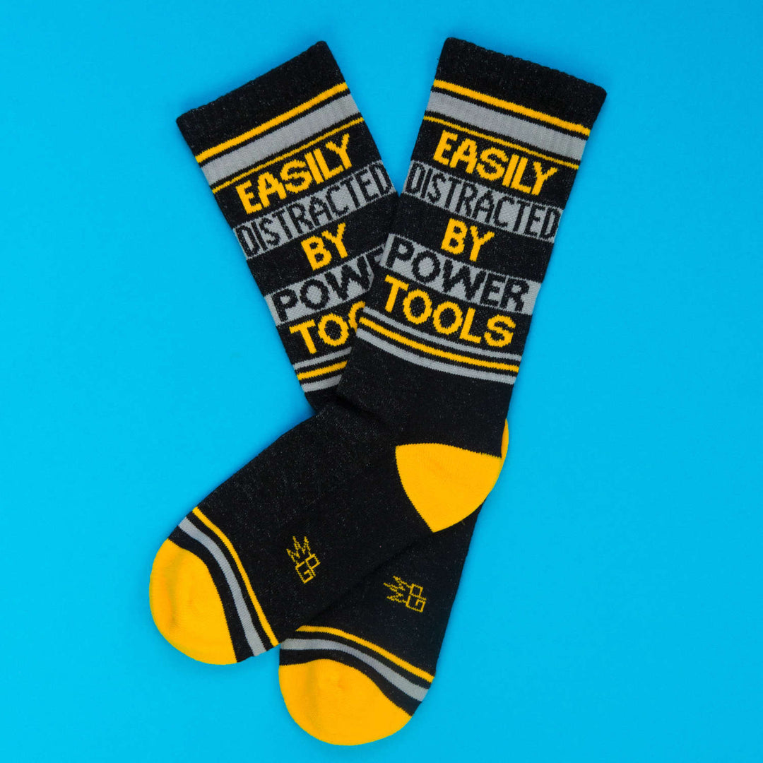 Easily Distracted By Power Tools Novelty Socks | Black/Gold/Light