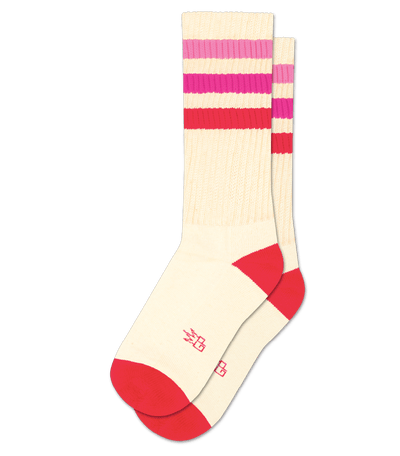 Natural cotton socks with fuschia stripes and accents, no visible text, plain background.
