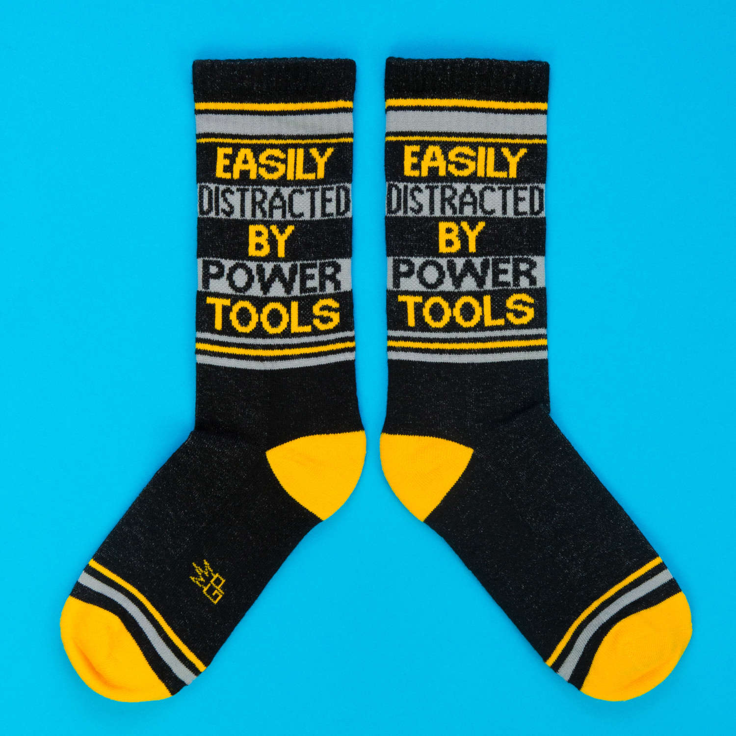 Easily Distracted By Power Tools Novelty Socks | Black/Gold/Light