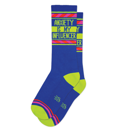 Royal blue sock with lime green accents and text "ANXIETY IS MY INFLUENCER."