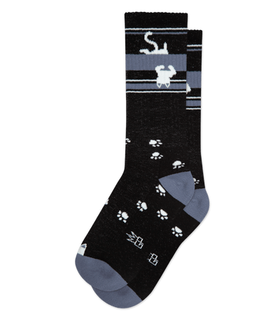 Black sock with white accents, stripes at the top, paw prints, and Japanese characters.
